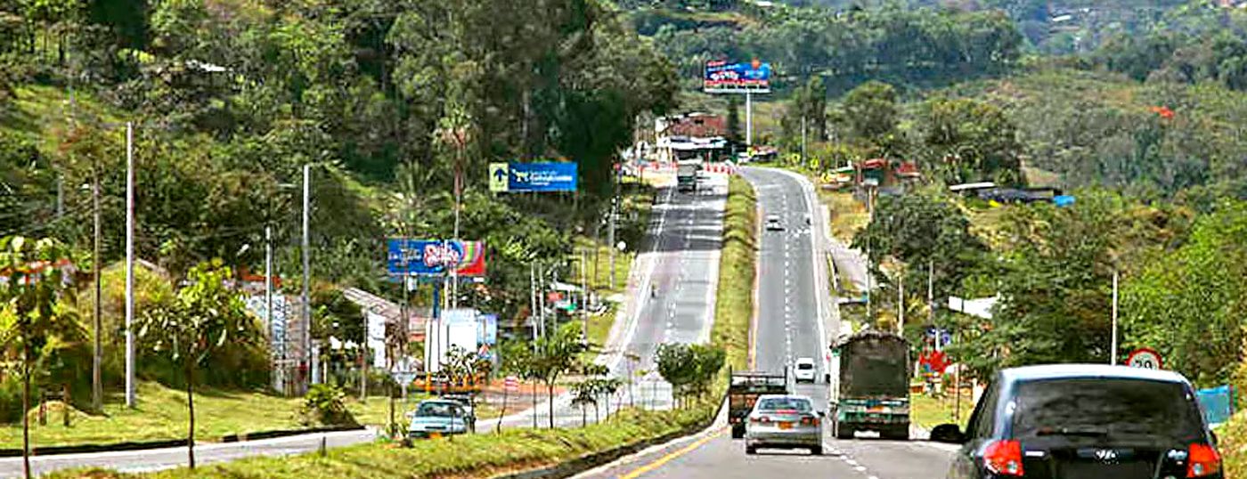 The Bogota to Melgar highway winding through tropical vegetation